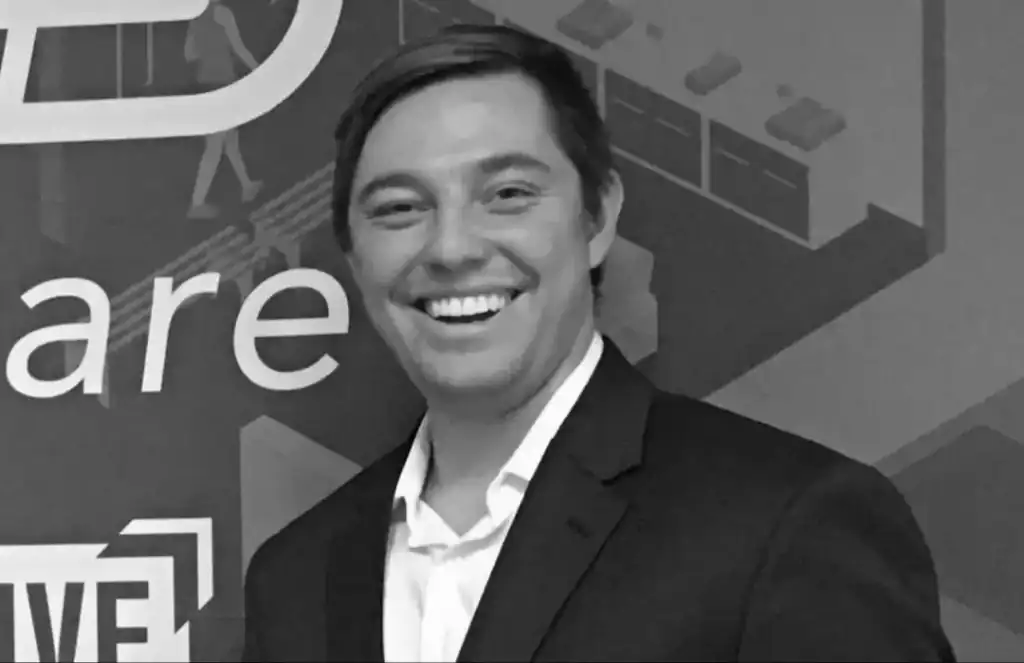 Team member smiling at a business event